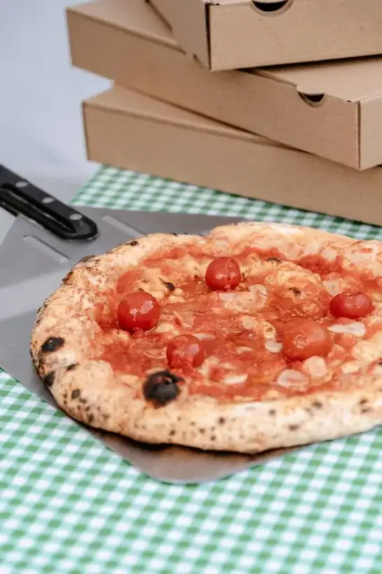 Close-up of Biga wood-fired pizza crust with leopard-spotted char
